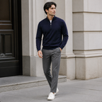 Navy business casual quarter zip sweater worn outdoors in a walking lifestyle pose.