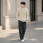 Beige thick ribbed quarter zip sweater worn outdoors in a walking lifestyle pose.