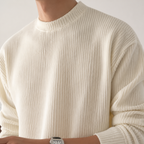 Close-up of the ivory white structured ribbed sweater neckline and vertical knit texture.