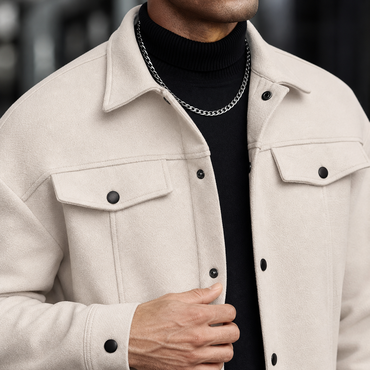 Close-up of the apricot trucker jacket collar, chest pockets, buttons and soft texture.