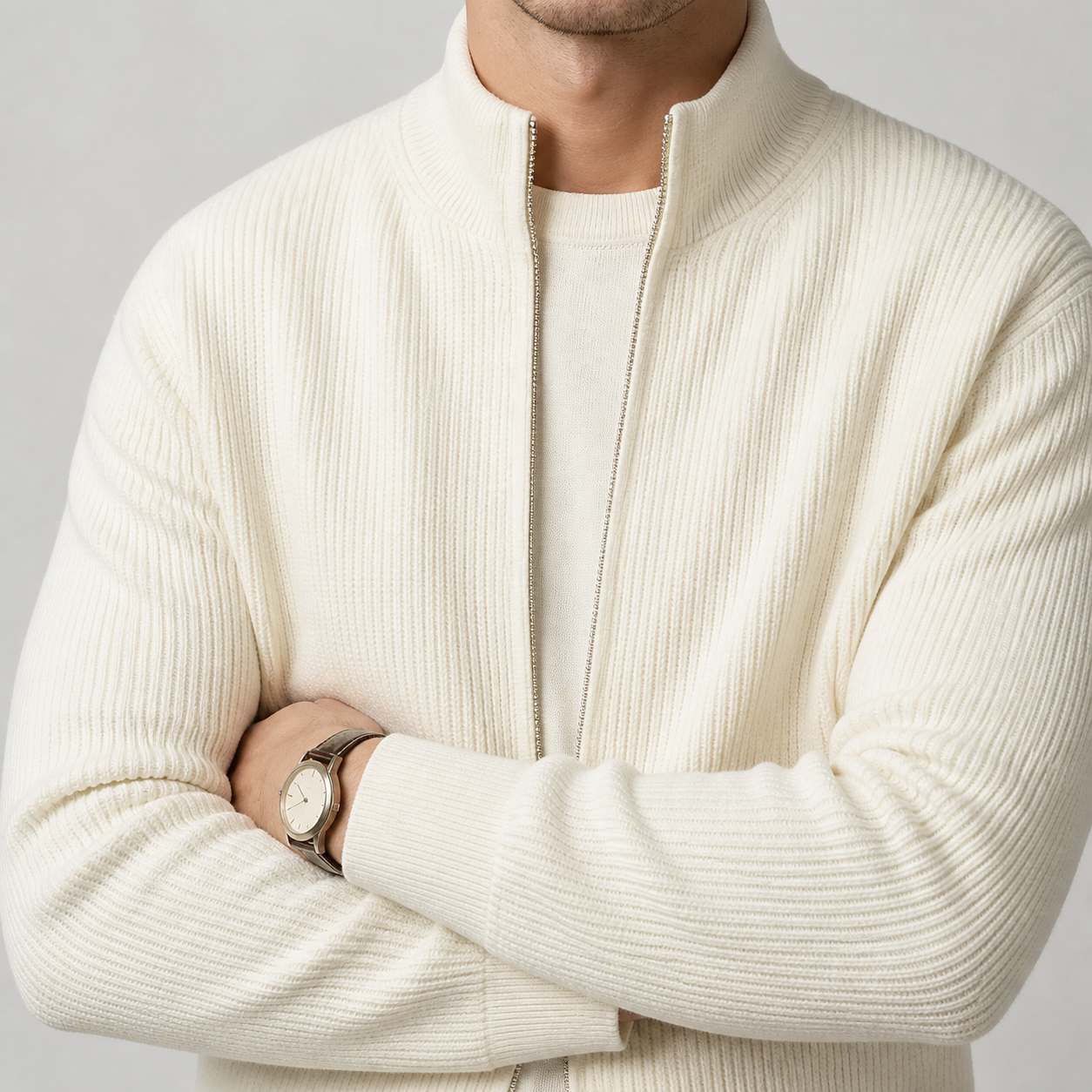 Close-up of the white ribbed zip up knit cardigan collar, zipper and knit texture.
