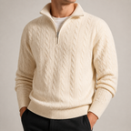 Off white cable knit half zip sweater on a male model in a clean studio.