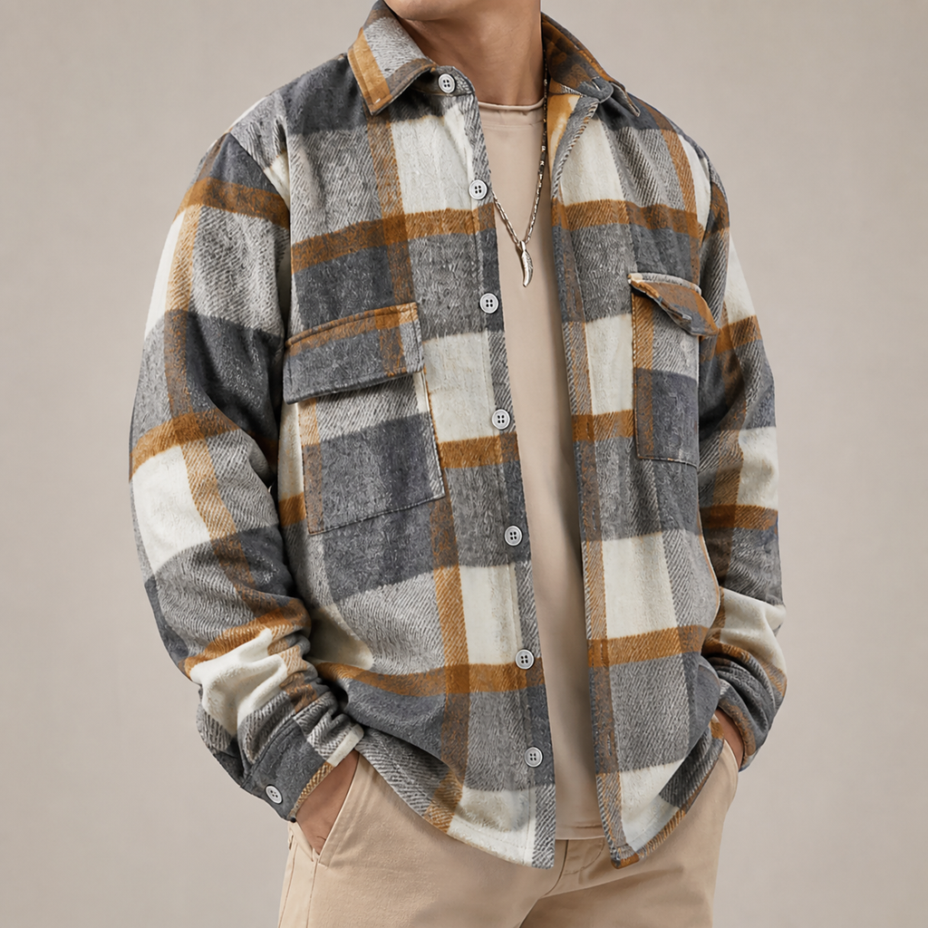 Grey white and brown plaid overshirt jacket on a male model in a clean studio.