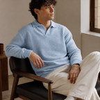 Light blue textured polo sweater seated indoor lifestyle corrected v4