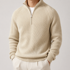 Beige thick ribbed quarter zip sweater on a male model in a clean studio.