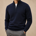 Navy business casual quarter zip sweater on a male model in a clean studio.