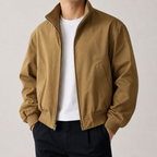 Khaki stand collar bomber jacket on a male model in a clean studio.