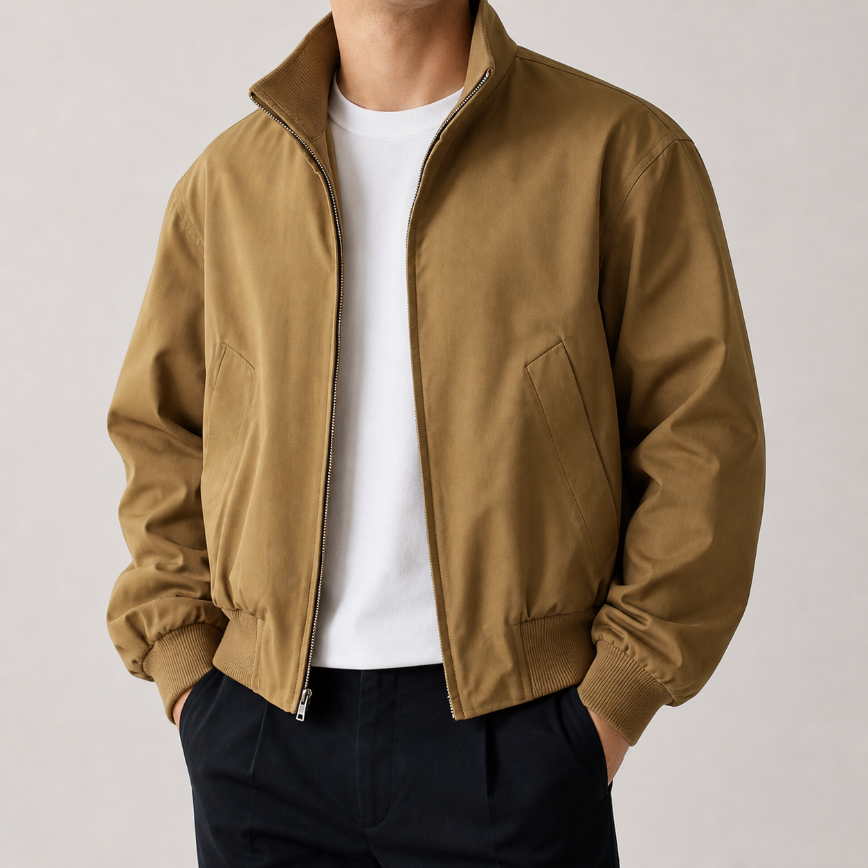 Khaki stand collar bomber jacket on a male model in a clean studio.