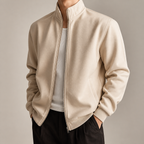 Apricot stand collar zip front jacket on a male model in a clean studio.